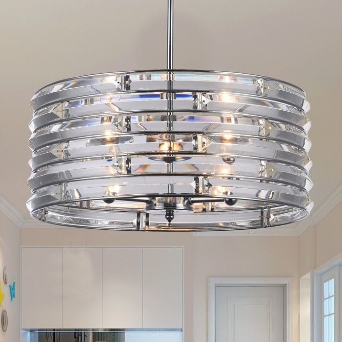 a chandelier hanging from the ceiling in a kitchen