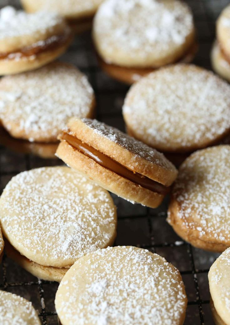 powdered sugar covered cookies on a cooling rack