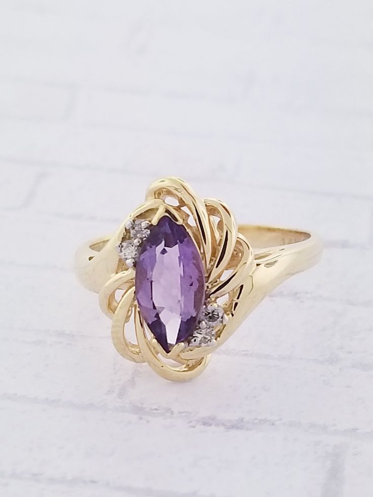 Vintage Amethyst & Diamond ring. This ring features a marquise shaped Amethyst and two diamonds on each side. Details: Size: US 6 1/4 ( Can be sized ) Weight: 3.5 grams Primary stone: Amethyst Stone Shape: Marquise ( Appx. 1.0 tcw. ) Secondary Stone: Diamond Stone Shape: Round ( Appx. 0.06 tcw. ) Metal: 14k Yellow Gold Condition: Brand new Inside of band is stamped and tested for '14k' gold. SIZING: Currently this ring is a size 6 1/4 but could be sized up or down for an additional small fee Amethyst And Diamond Ring, Book Jewelry, Precious Jewels, Amethyst Jewelry, Multi Stone Ring, Amethyst Stone, Multi Stone, Diamond Stone, Custom Rings