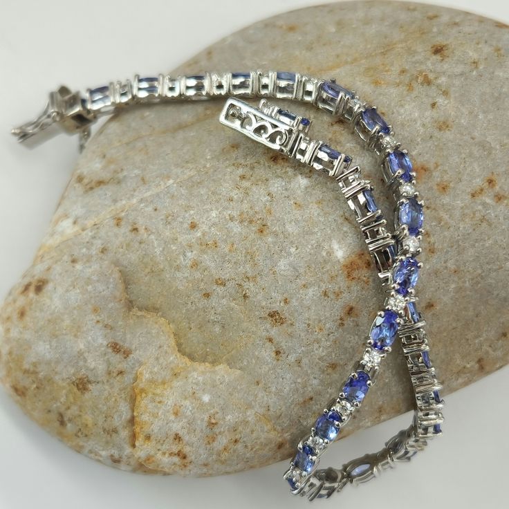 Aaa Tanzanite And Moissanite. Bracelet. (8) In. Platinum Over Sterling Silver Aaa Tanzanite Ovals. (26) Ct.(53) Mm. Moissanite Rounds. (26) Ct.(2) Mm. (8) Ctw.Prong Set. Tab Insert. Aaa Tantalizing Tanzanite Color's. Blue Purplish Blue. Blueberry Violet Blue Adjacent Next To Electrifying Scintillating Glistening Moissanite. Beautiful Gorgeous. New. Gift Box Included. Sterling Silver Bracelet With Prong Setting, Silver Sapphire Tennis Bracelet With Brilliant Cut, Sterling Silver Tennis Bracelet With 17 Jewels, Sterling Silver Diamond Bracelet With Gemstone, White Gold Sapphire Gemstone Tennis Bracelet, Silver Sapphire Bracelet For Anniversary, Silver Sapphire Bracelets For Anniversary, Silver Tanzanite Jewelry With Diamond Accents, Luxury Silver Tanzanite Jewelry