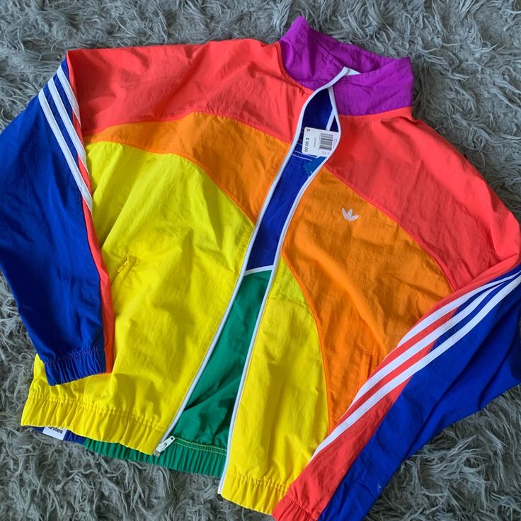 New With Tags Size Small Spring Multicolor Color Block Windbreaker, Retro Yellow Windbreaker For Spring, Trendy Multicolor Spring Windbreaker, Trendy Multicolor Long Sleeve Windbreaker, Spring Multicolor Patchwork Windbreaker, Adidas Yellow Long Sleeve Outerwear, Adidas Yellow Outerwear For Streetwear, Sporty Multicolor Windbreaker For Spring, Trendy Rainbow Outerwear For Fall