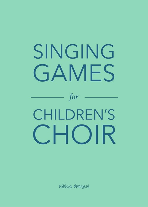 the cover of singing games for children's choir, with blue lettering on a green background