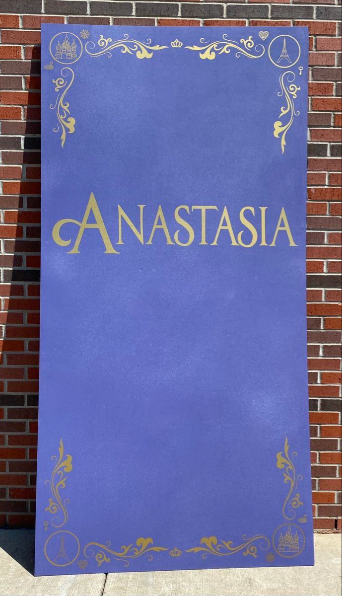 a blue sign that says anastasia in gold lettering on it's side