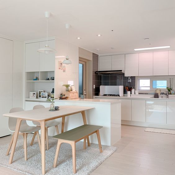 the kitchen is clean and ready to be used as a dining room or living room