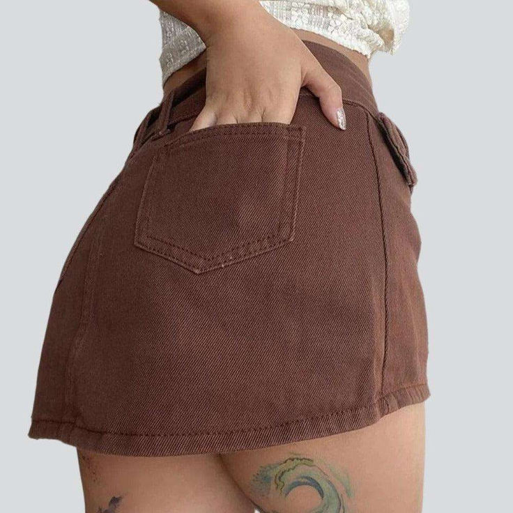 Reinvent your edgy trend with this 2023 Summer Collection Brown Ladies Mini Jean Skirt! This mid-waist skirt features a enduring zipper and button closure, perfect for giving any ensemble a little extra oomph.Why You'll Love It: Street Style: This mini skirt brings on-style style to any outfit for a show-stopping look. Vibrant Brown Color: The rich brown hue brings a stylish and eye-catching look to your vibe. Mid-Waist Fit: The medium-waist fit ensures a flattering silhouette, perfect for any b