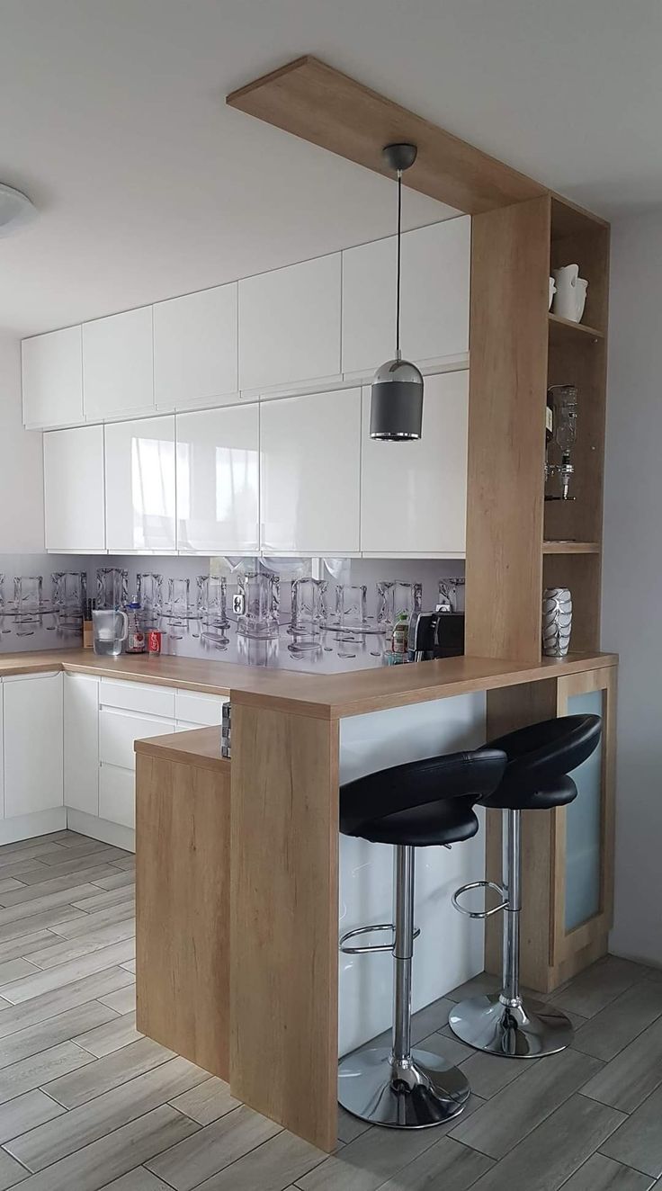 a kitchen with two bar stools in it