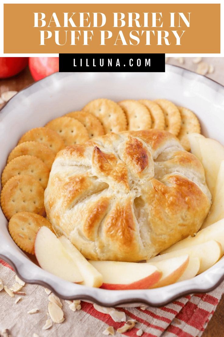 baked brie in a white dish with apples and crackers on the side, text overlay reads baked brie in puff pastry