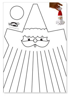 a santa claus face cut out on a piece of paper