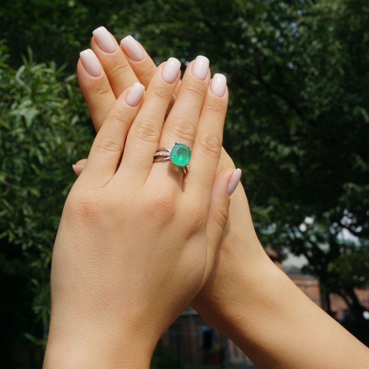 A Breathtakingly Striking  HANDMADE 14k White Gold Ring with Beautiful Cushion Cut Emerald in RICH Green color! The GEM is 5.28 CT and measure 12.36x11.19x5.63 mm! This Stone will take your breath away, especially on the sunlight! You will want to look at this stone endlessly.The mounting is a masterpiece! HANDMADE 14K White Gold Mounting (tested), that was is custom made to Accommodate this Beauty of a Gem in V-Prongs setting! Super FINE Workmanship on the Diamond prong  setting with 14 pcs Brilliant Full Cut Diamonds in G color, VS clarity, totaling to approx 0.47 ct! Fabulous Braided Band and Diamond Gallery! The Entire Top's outline is 13.0x11.0 mm - HUGE. The Ring weights 6.7 g, nice and SOLID. Sits 9.0 mm off the top ofthe finger. Finger size 7 Center Stone: Emerald (100% Natural) Ce Luxury Gia Certified Emerald Cut Gemstones, Luxury White Gold Gia Certified Gemstones, Luxury Gia Certified White Gold Gemstones, Elegant Green Gia Certified Gemstones, Gia Certified Elegant Emerald Gemstones, Elegant Gia Certified Emerald Gemstones, Gia Certified Platinum Gemstones Fine Jewelry, Emerald Cut Platinum Gemstones In White Gold, Gia Certified Emerald Cut Gemstone For Fine Jewelry