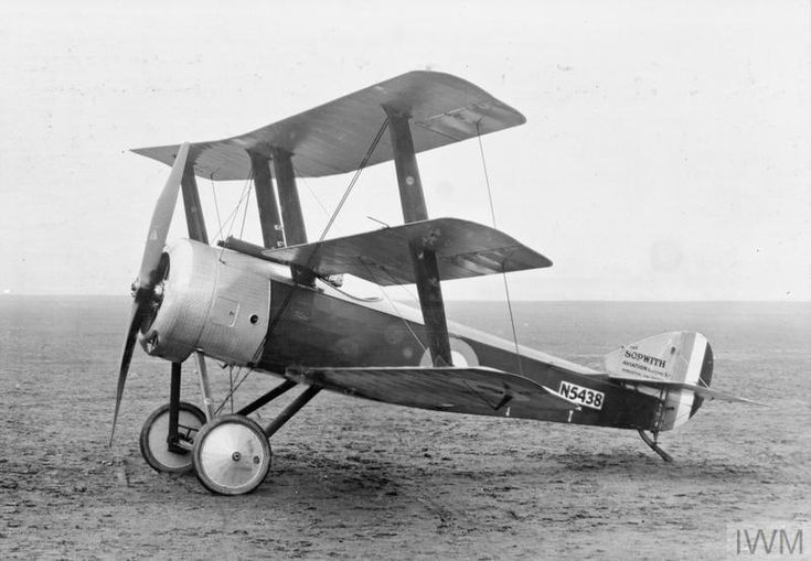 an old airplane sitting on top of a field