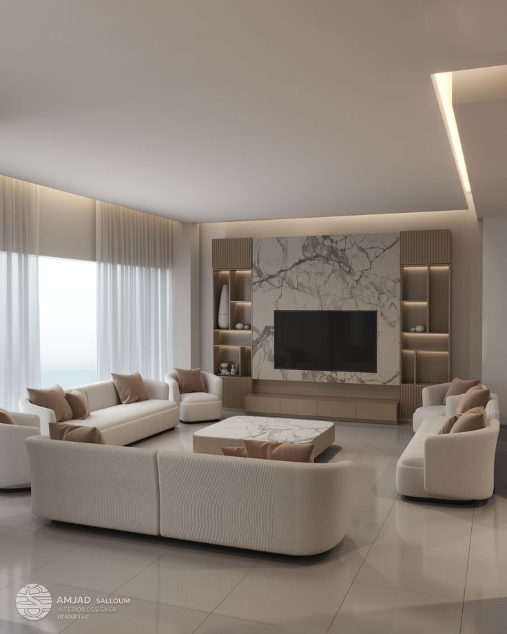 a living room filled with white furniture and a flat screen tv mounted on the wall