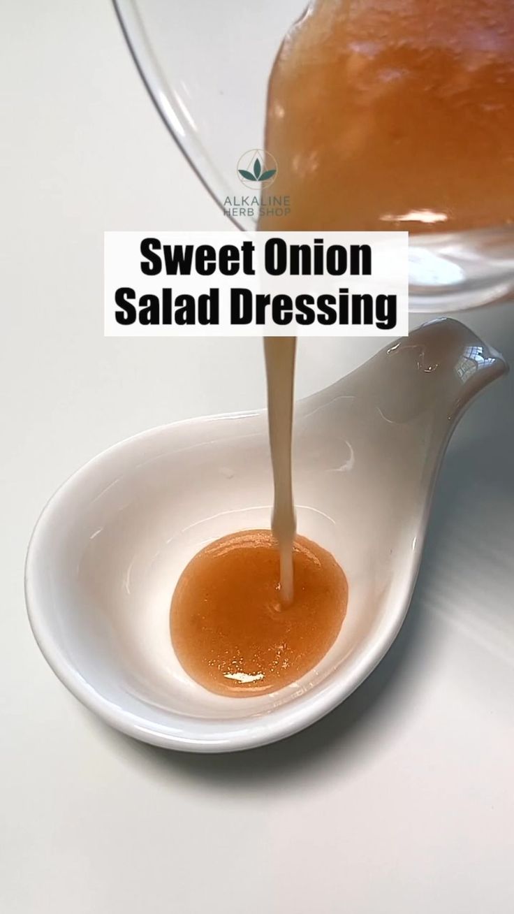 a spoon pouring sauce into a bowl with the words sweet onion salad dressing on it