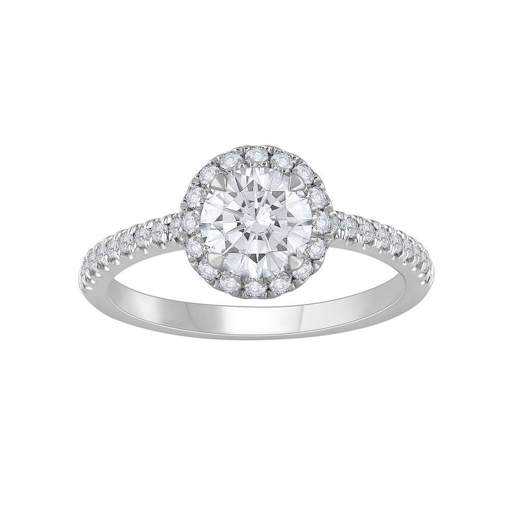 a white gold ring with diamonds on the band and a round center stone in the middle