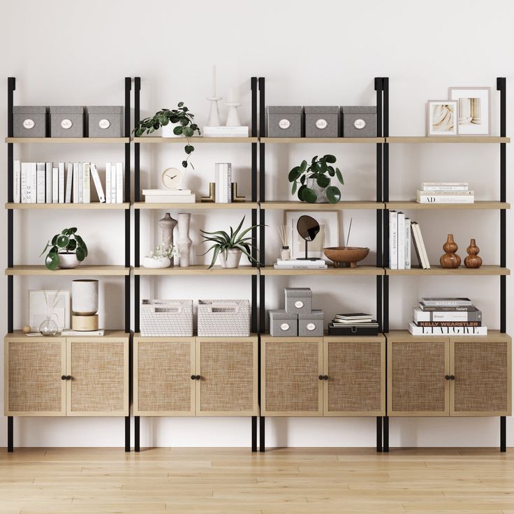 an empty room with many shelves and plants on the top one shelf is filled with books