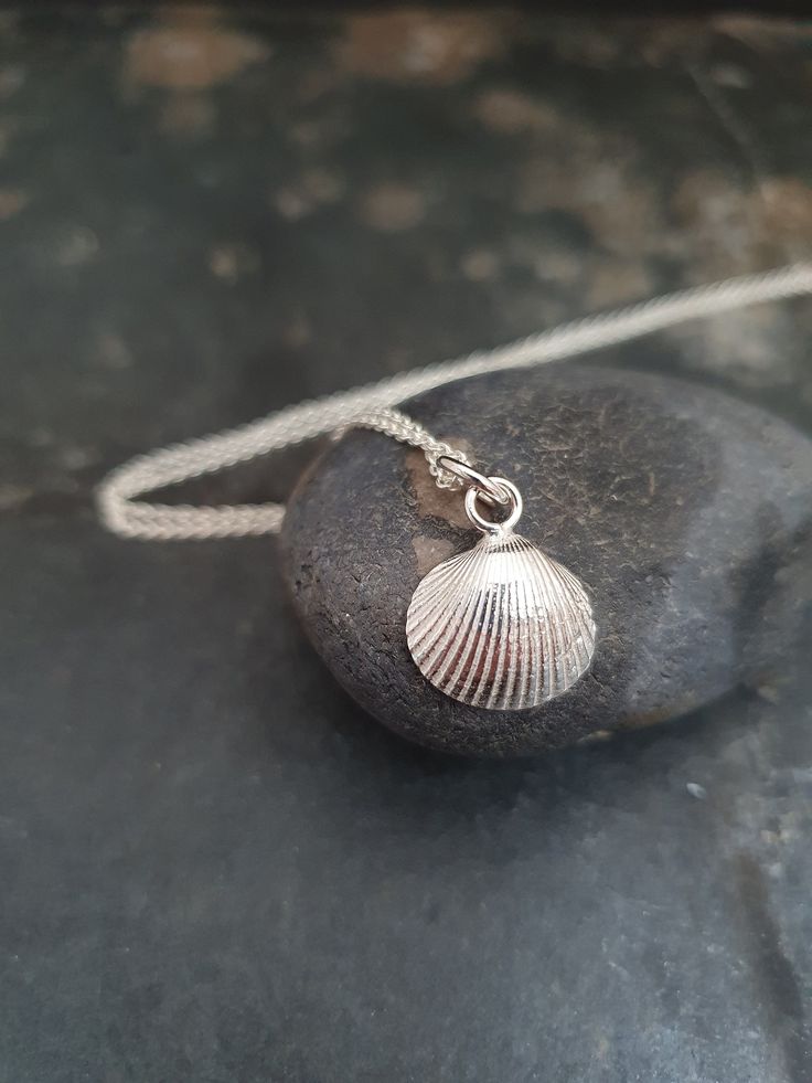 Tiny shell on a necklace, sterling silver. Proces: During a walk on the beach of Vlieland, one of the Wadden Islands, I found this tiny shell. I made a cast of it in 925 sterling silver. Measurements: The shell has a prox diameter of 1 cm. You can chose from a variety of lengths for the necklace. It is also possible to order the shell without a necklace. Materials: Sterling silver Packaging: All items are carefully wrapped in a gift box and a handmade linnen envelop. Shipping and insurance: I of Cast Of It, Heart Soap, Silver Packaging, Walk On The Beach, Linen Bag, Beach Walk, Necklace Sterling Silver, Jewelry Maker, Walk On