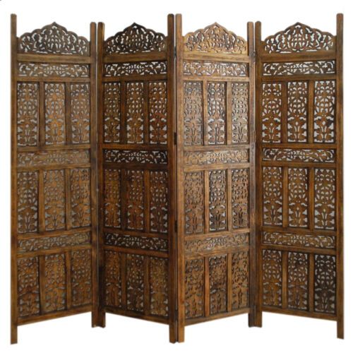 an ornate wooden room divider with intricate carvings