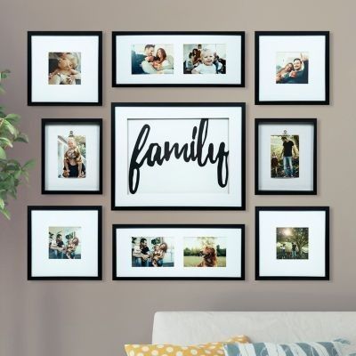 a family photo hanging on the wall above a couch