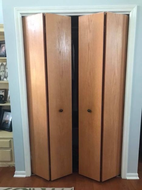 two wooden doors are open in a room