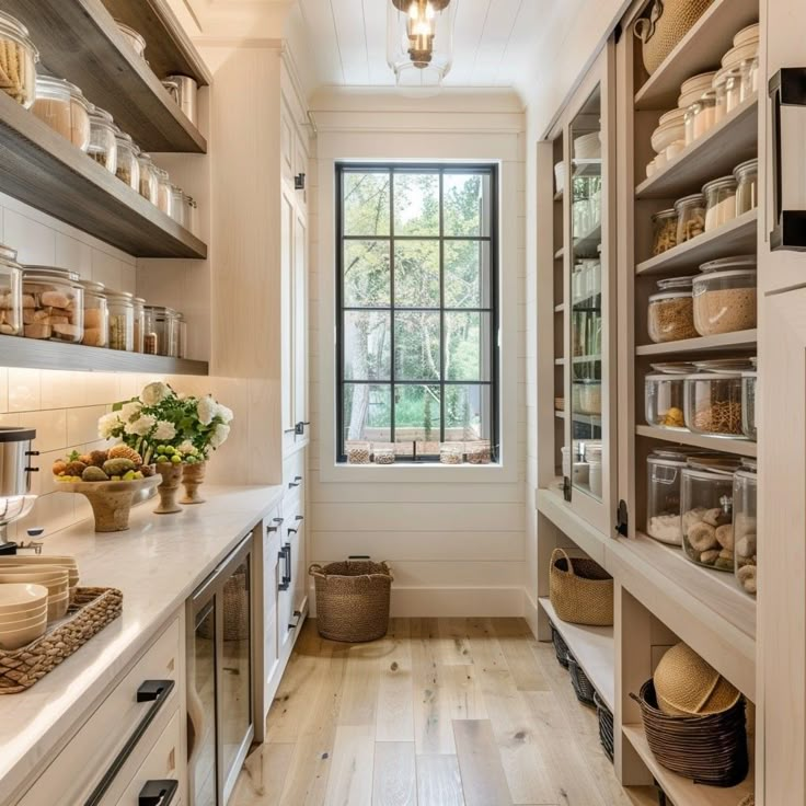 a kitchen filled with lots of open shelves