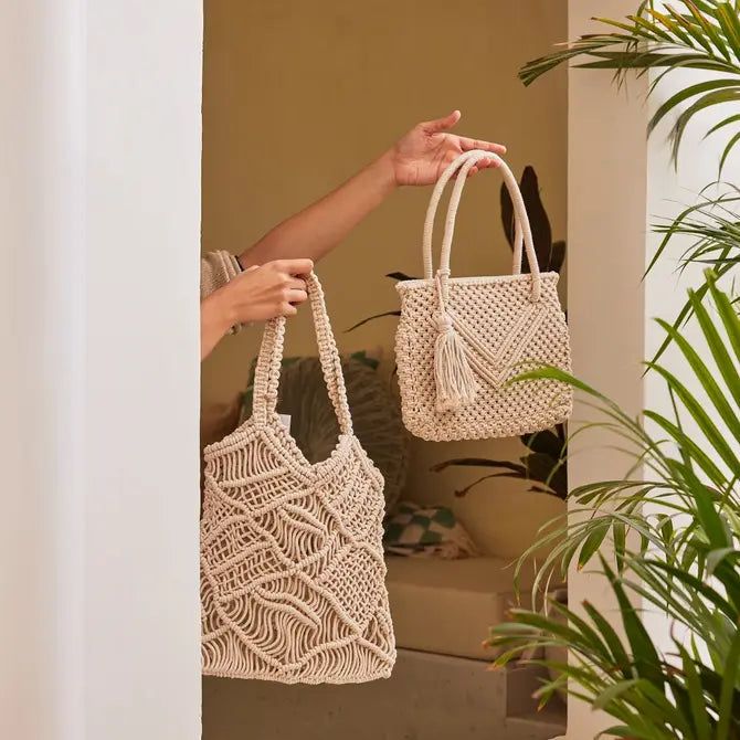 This gorgeous hand knotted macrame tote bag that touts a bohemian aesthetic. Made from macrame, this statement piece can transform any outfit! The beautiful knots of varying sizes lend it a unique flavor. • Ethically made in India• Cotton Construction• Size- 14 x 13 inch• Care instructions: spot clean• Perfect for spring and summer• Boho Decor Macrame Tote Bag, Bohemian Aesthetic, Macrame Bag, Boho Bags, Summer Boho, Eco Friendly Gifts, Boho Summer, Shopping Tote Bag, Velvet Pillows