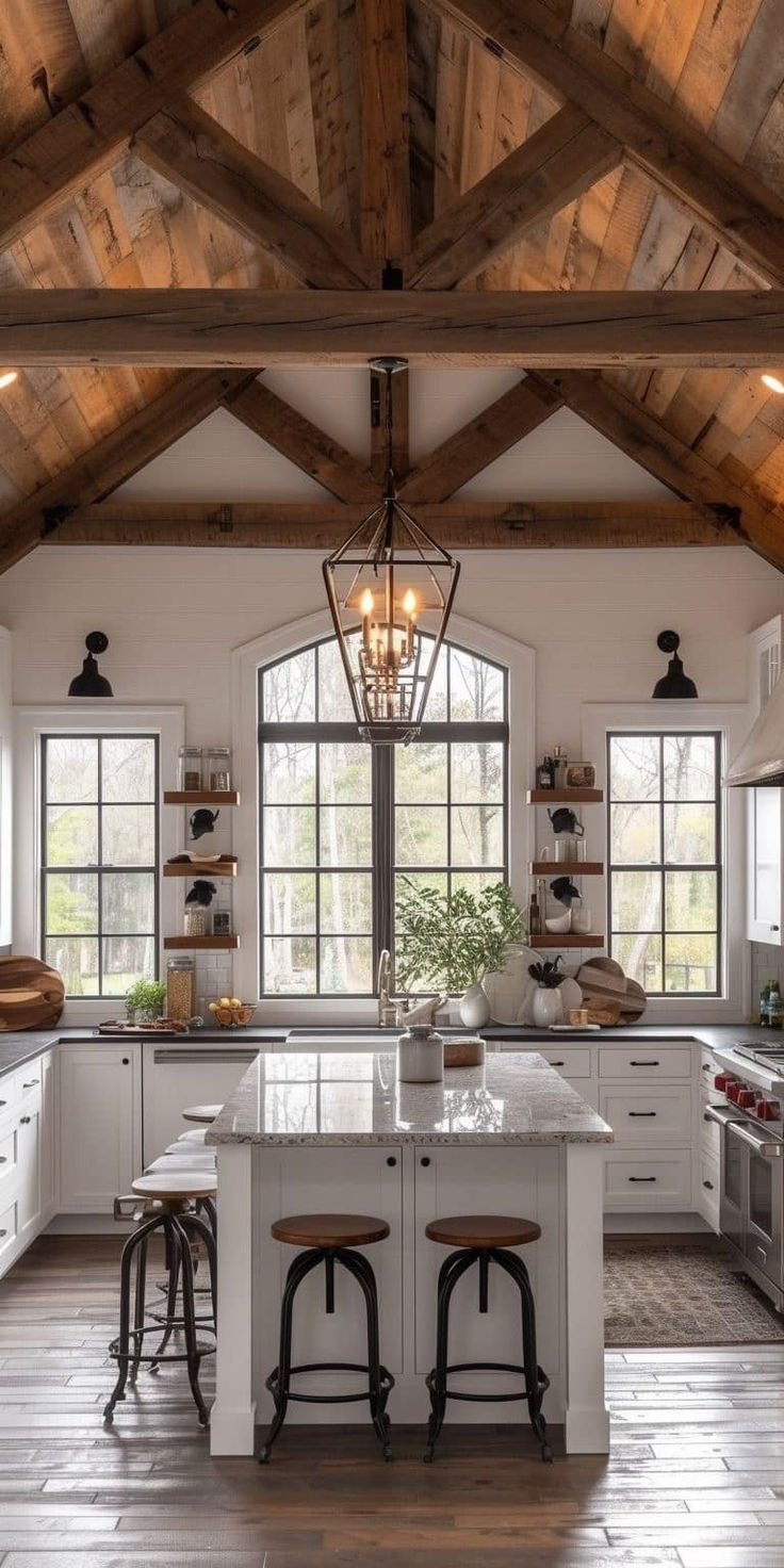 a large kitchen with white cabinets and wooden beams on the ceiling, along with two stools