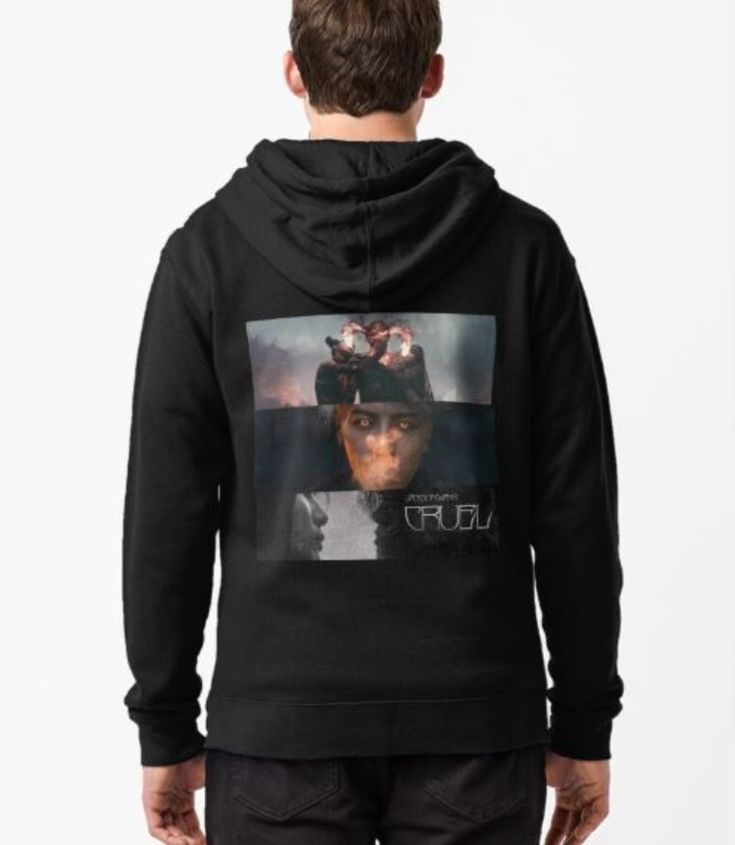 a young man wearing a black hoodie with an image of a woman's face on it