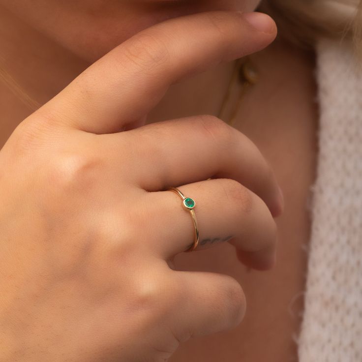 Elevate your style with our Emerald Solitaire Ring in 14k/18k Solid Gold.  Perfect for stacking or as a minimalist statement piece. Celebrate May birthdays or any special occasion with this stunning emerald gemstone ring.  Shop now and make it yours!, Material: Solid Real Gold (Not gold plated or gold fill) Available Gold Karat: 14K (585), 18K (750)  Available Gold Colors: Yellow, rose, white Gemstones: Natural emerald Number of Emeralds: 1 Emerald shape: Round Emerald size: 3 mm Emerald CTW: 0. Minimalist Birthstone Ring With Bezel Setting, Dainty 14k Gold Emerald Ring For Everyday, Fine Jewelry Stackable Rings With Smooth Bezel As Gift, 14k Gold Birthstone Ring With Smooth Bezel For Promise, Dainty Stackable Rings With Smooth Bezel For Gift, Everyday Bezel Setting Birthstone Ring, Everyday Birthstone Ring With Bezel Setting, Minimalist Bezel Set Birthstone Ring With Round Band, Dainty Emerald Ring With Bezel Setting