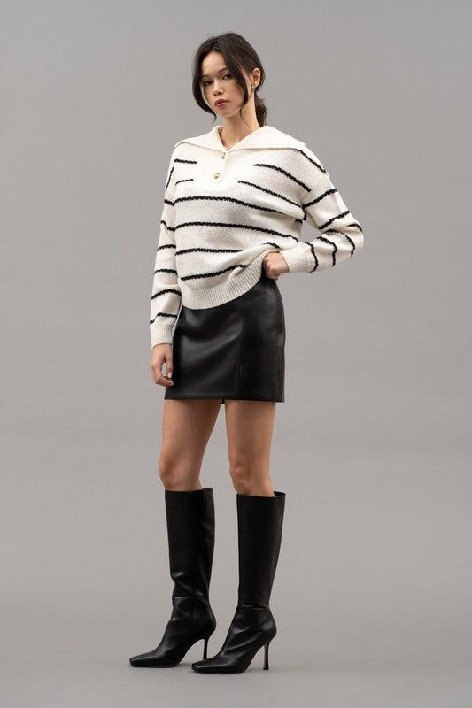 Sweater weather has never looked so good. This Dani Collar Sweater cozy striped sweater features a shawl collar and relaxed knit fit. Model is wearing a small 65% Polyester 35% Acrylic Fall Black Sweater With Striped Collar, Striped Sweater For Winter Workwear, Winter Striped Sweater For Workwear, Winter Striped Sweater For Work, Fall Outerwear With Striped Collar And Long Sleeves, Striped Knit Outerwear For Fall, Chic Striped Sweater With Ribbed Collar, Fall Long Sleeve Outerwear With Striped Collar, Chic Collared Polo Sweater For Winter