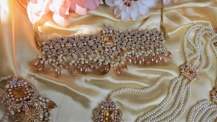 A must have for the upcoming wedding season! This bridal set is a unique blend of royal and modern with its pastel hues and gold plating. The set is gorgeous with pearls and is a full bridal piece but can be worn separately for a lighter and simple look. Set includes: mala , earrings, maang tikka , passa, choker In stock and ready to ship‰Û? Elegant Kundan Bridal Accessories For Party, Elegant Gold Bridal Accessories For Festive Season, Elegant Gold Sets For Reception, Elegant Gold Bridal Accessories With Tilla, Elegant Bridal Accessories With Stone Work For Party, Elegant Party Bridal Accessories With Stone Work, Party Sets With Pearl Embroidery In Gold, Gold Pearl Bridal Accessories For Party, Elegant Pearl Bridal Sets For Reception