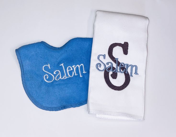 two blue and white bibs with the word salem on them