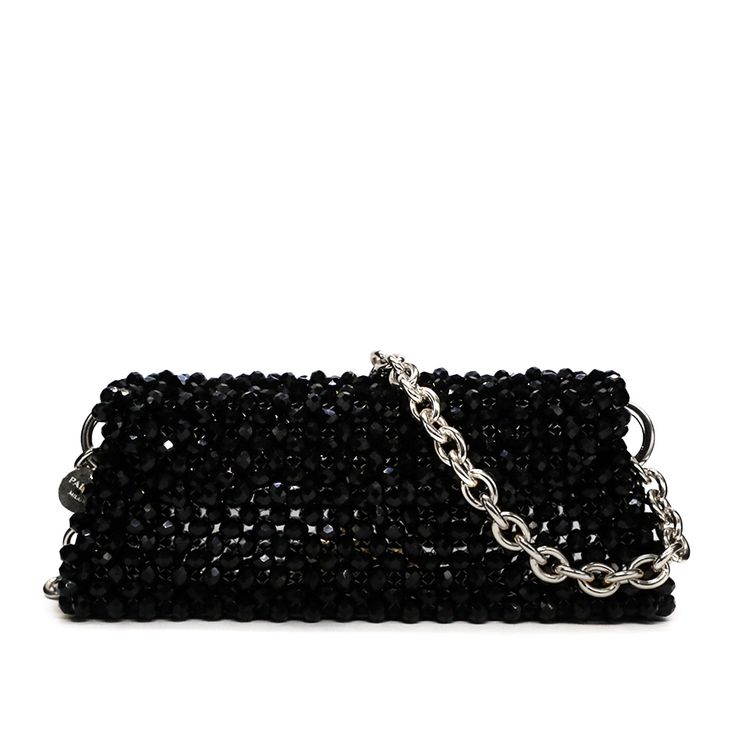 Introducing the Santorini shoulder bag, a stunning accessory that exudes elegance and sophistication. Handcrafted in Italy, this bag features a mesmerizing design adorned with crystals beads, adding a touch of sparkle to any ensemble. Made from high-quality crystal beads, it exudes an air of luxury. The unlined interior provides a minimalist aesthetic while offering ample space to fit your essentials. Material: Crystals beads Unlined Height: 10 cm Width: 24 cm Depth: 6 cm Complete with a 1-meter Iphone Card Holder, Crystals Beads, Crystal Bags, Minimalist Aesthetic, Black Crystals, Santorini, Gold Hardware, Crystal Beads, Luxury Design