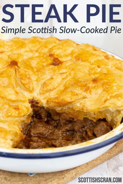 a close up of a pie in a bowl with the words steak pie on it