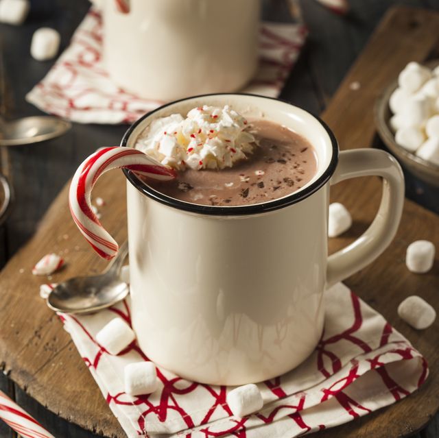 hot chocolate with marshmallows in a white mug on a red and white napkin