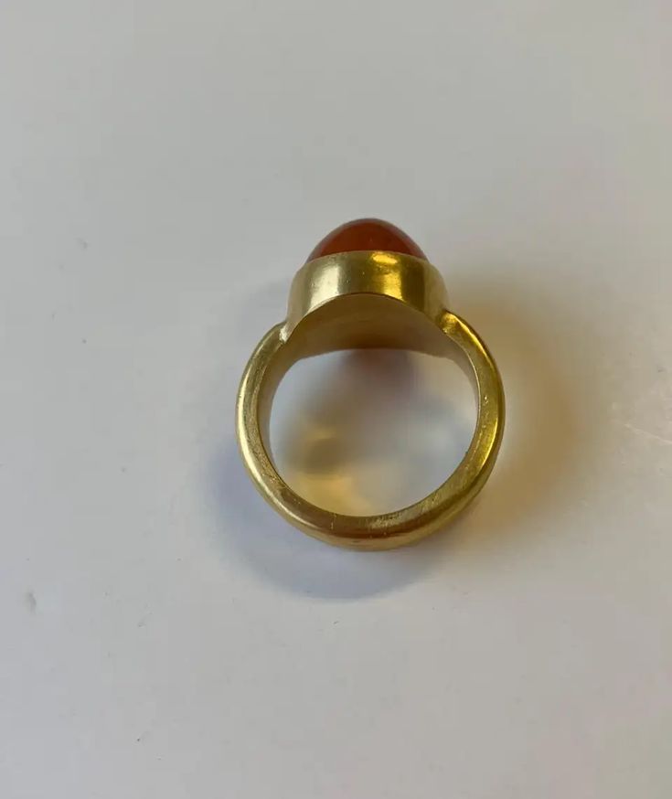 For Sale on 1stDibs - This beautiful Spessartite Garnet cabochon ring in 22 Karat gold with granulation, illustrates how ancient jewelry techniques are applied to contemporary Gold Round Cabochons With Bezel Setting, Gold Polished Cabochons For Anniversary, Gold Domed Gemstone Cabochons, Domed Gold Gemstone Cabochons, Gold Ruby Ring Oval Cabochon With Polished Finish, Gold Heirloom Signet Ring With Cabochon, Gold Spiritual Rings With Bezel Setting, Heirloom Gold Signet Ring With Cabochon, Spiritual Gold Rings With Bezel Setting