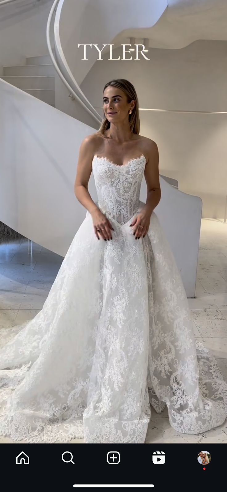 a woman in a wedding dress posing for the camera