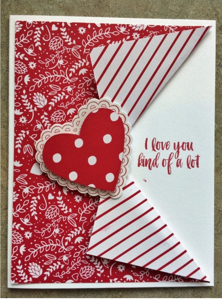 a red and white card with a heart on it