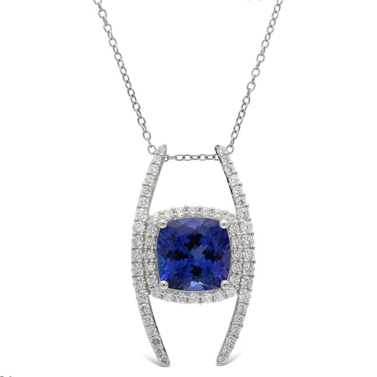 Metal: 14K White Gold Gemstones: 5.00 Cts. Tanzanite 0.95 Cts. Diamond Diamond White Jewelry With Round Tanzanite, Diamond White Tanzanite Round Jewelry, Luxury Tanzanite Jewelry With Brilliant Cut, Tanzanite Pendant Necklace With Brilliant Cut, Formal Tanzanite Diamond-cut Jewelry, Halo Necklace, Halo Diamond, Diamond Pendant, Halo