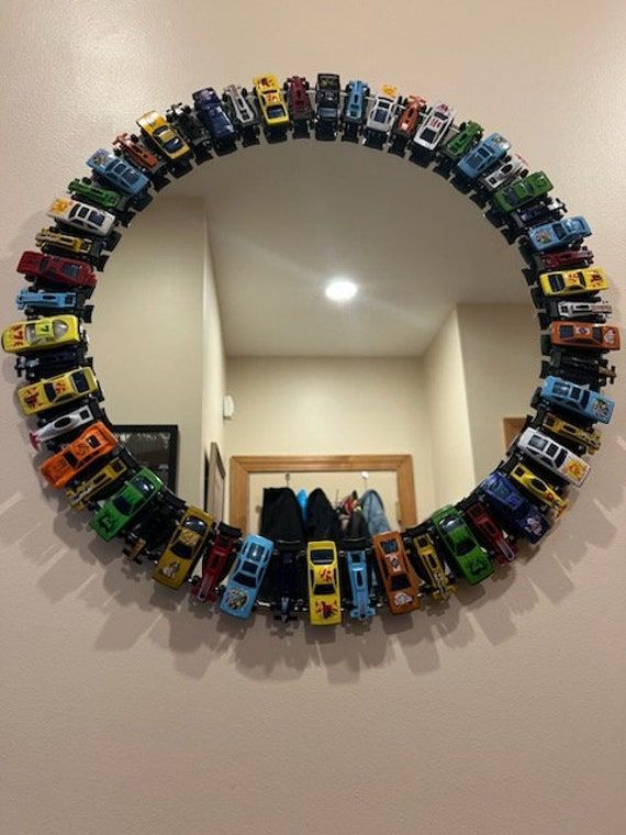 a mirror that has cars in it on the wall