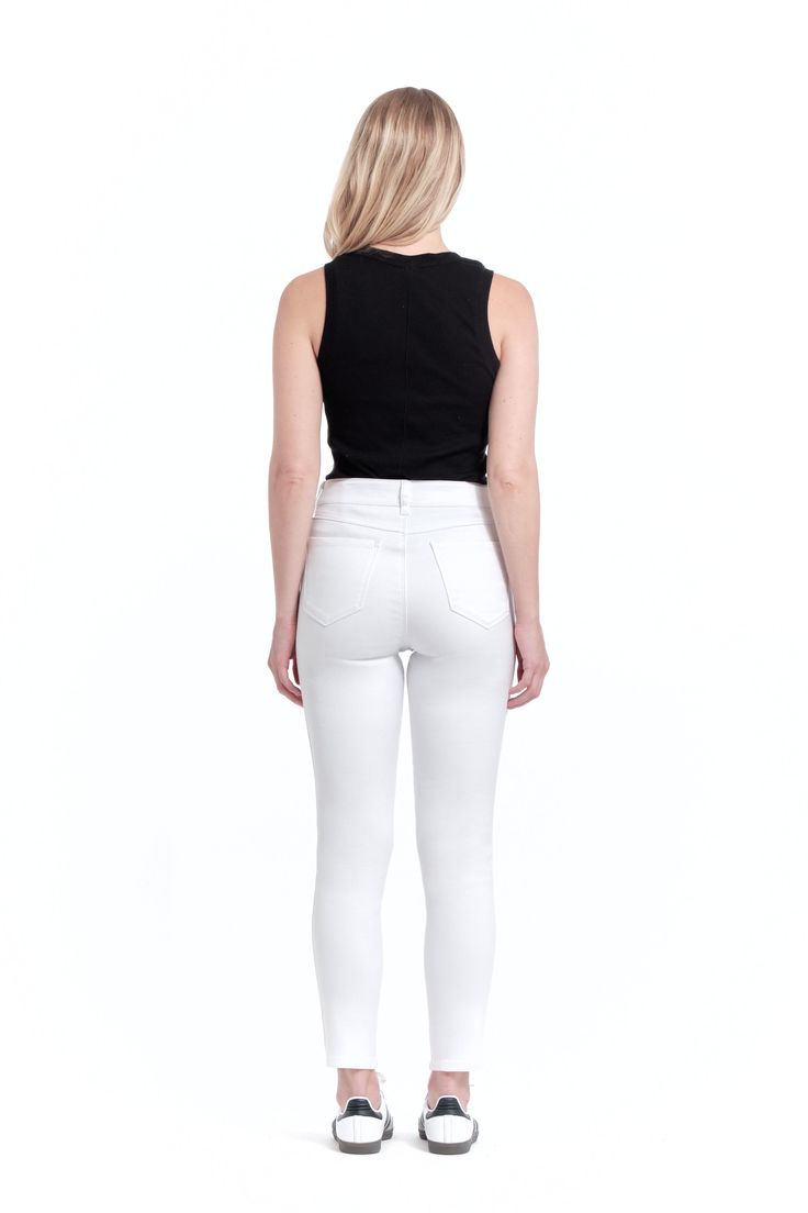 Part of our New Butter Core collection, the new butter skinny in white is made to fit you better. Stay stylish in the ultra-comfortable, ultra-chic, ultra-soft style you love. We even gave her a cool, new name. Meet the Gia Skinny! Style has extra stretch but fits true to size - if in between sizes, we suggest sizing down High-rise ankle skinny jeans Feels like jeggings Made with Premium Butter Fabric 5 pocket design SKU: CJ2C1084A1-WHI 79% Cotton 20% Polyester 1% Spandex Machine wash cold Imported Product Measurements: 28" Inseam, 10" Front Rise, 9.5" Leg Opening Model is wearing a size 27 - Height: 5’7”, Waist: 26”, Hips: 35.5” From the Designer - "We took your feedback and are thrilled to announce the relaunch of our Butter Denim collection which is now true to size and even more comfor Denim Collection, Soft Style, Second Skin, Pocket Design, Jeggings, Body Shapes, Casual Chic, High Rise, Butter