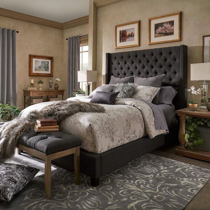 a bedroom with a large bed and lots of pillows