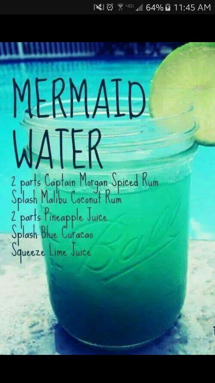 a jar filled with green liquid next to a swimming pool and the words mermaid water on it