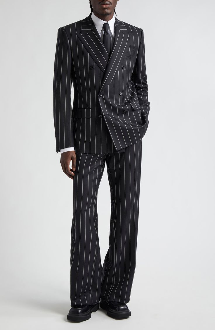 Polished pinstripes bring this season's pared-down precision to runway-featured trousers tailored in Italy from pure wool. Zip fly with button closure Front slant pockets; back button-welt pockets 100% wool Dry clean Made in Italy Designer Clothing Man Fashion Suit, Fancy Mens Fashion, 4 Button Suit Men, Street Wear Suit Men, Club Mens Outfit Night, Farewell Suit Ideas Men, Men Formal Wear Classy, Expensive Suits Men, Flared Suit