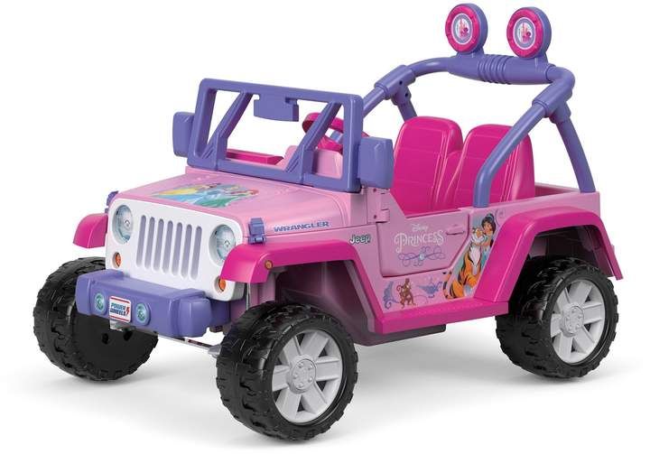 a pink toy jeep with purple seats and wheels