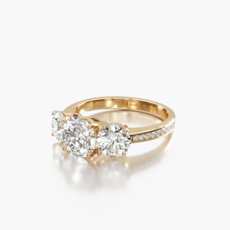 two stone engagement ring with diamonds on each side and an oval diamond in the middle