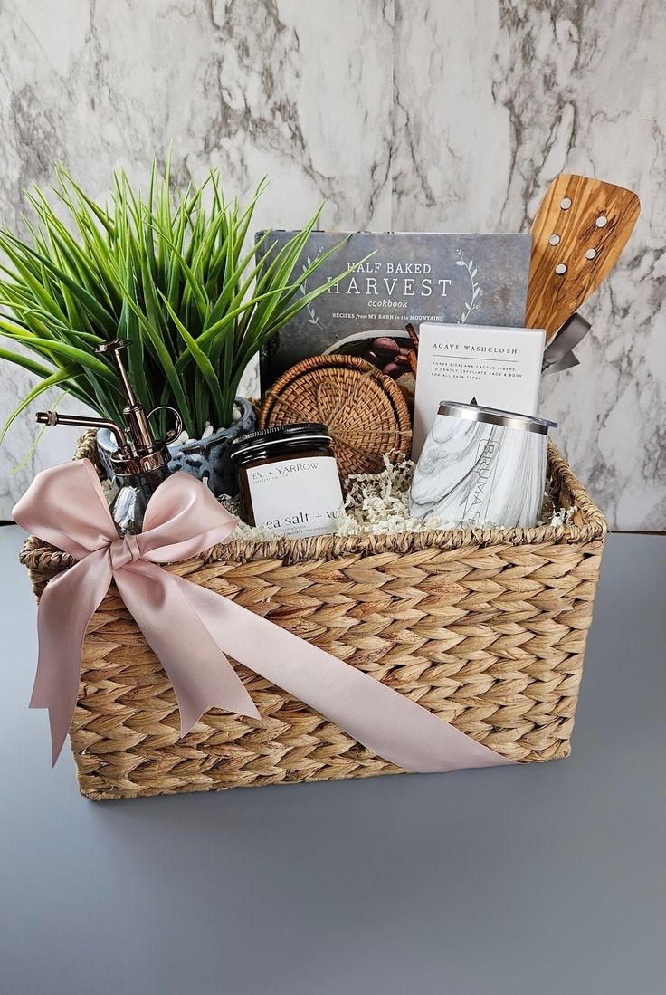 a wicker basket filled with lots of goodies on top of a table next to a marble wall