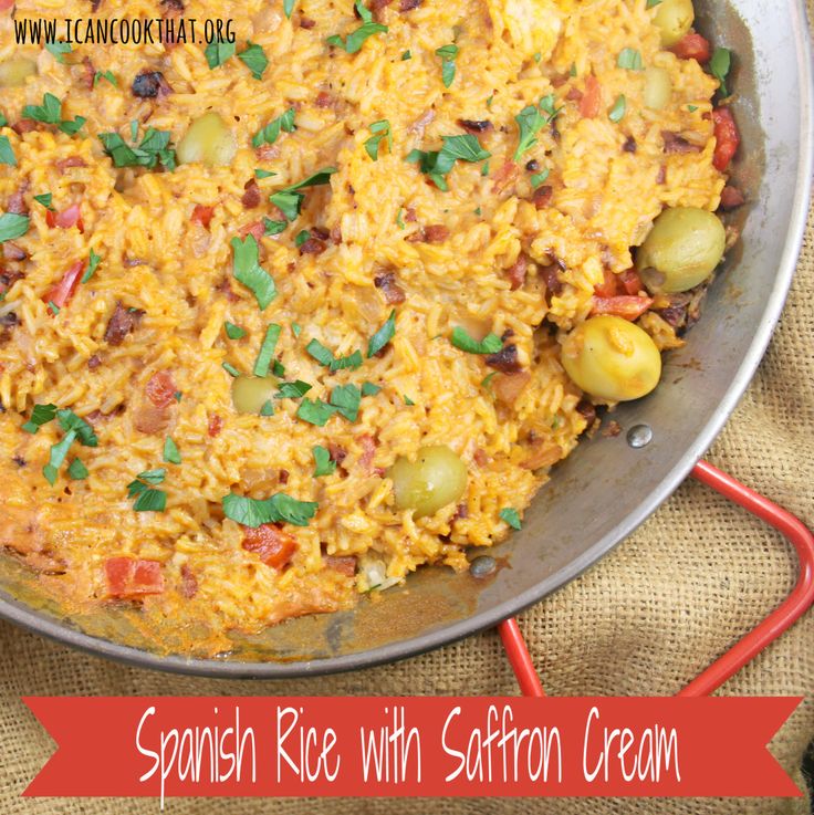 spanish rice with saffroni and olives in a skillet