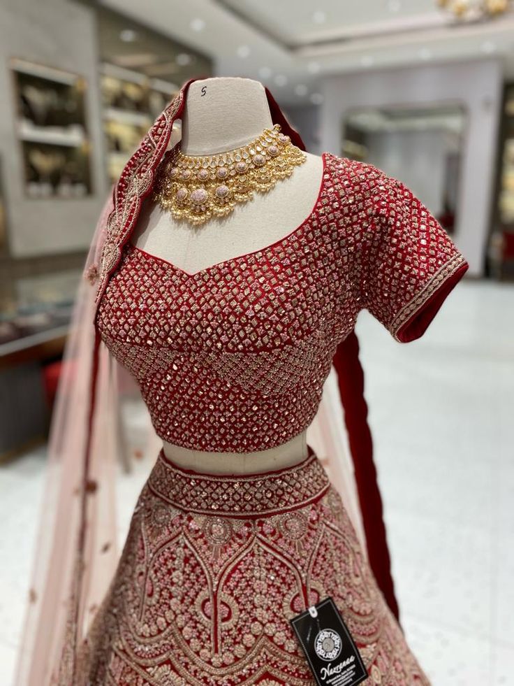 Indulge in luxury with our Bright Red Bridal Lehenga BL-106. Expertly crafted with premium materials, this stunning lehenga exudes elegance and sophistication. Its bright red color will make you stand out on your special day, while the intricate details and design will leave you feeling like royalty. Elevate your bridal look with our BL-106 lehenga. Fabric: Raw Silk! WASH CARE INSTRUCTIONS - Please Dry clean only when it is applicable! Ready to Ship! Red Traditional Wear For Designer Diwali, Red Sharara With Dori Work For Designer Wear, Red Dori Work Sharara For Designer Wear, Designer Red Dori Work Sharara, Elegant Red Sharara With Dori Work, Designer Red Sharara With Zari Work, Red Designer Wear Sets With Resham Embroidery, Elegant Red Anarkali Set With Cutdana, Red Cutdana Lehenga For Reception