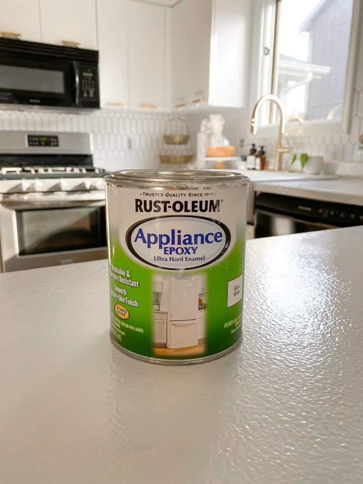 a can of appliance sitting on top of a white counter in a kitchen