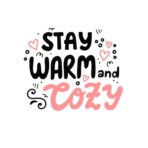 the words stay warm and cozy are shown in pink, black and white letters on a white background