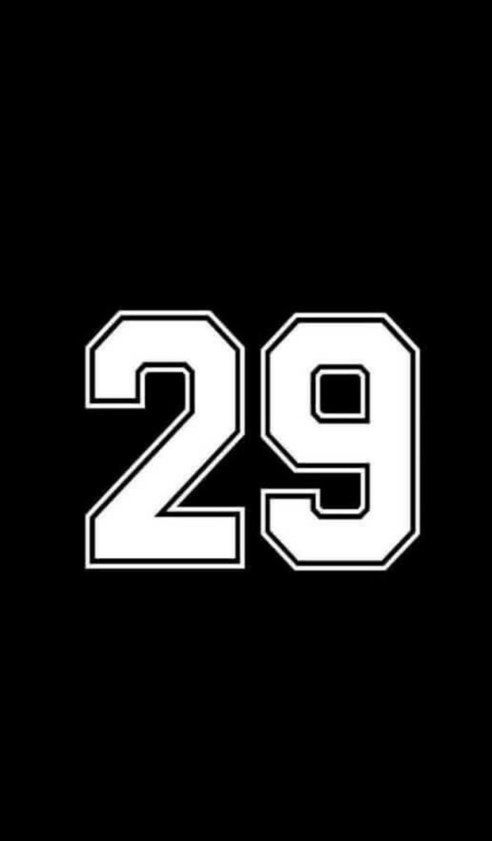 the number twenty nine is shown in white on a black background, and it appears to be 29 years old